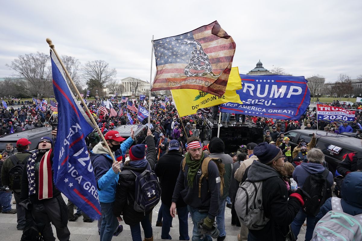 FILE - Insurrectionists loyal to President Donald Trump swarm the Capitol, Jan. 6, 2021, in Washington. A college student who posted online that “Infamy is just as good as fame. Either way I end up more known. XOXO” after she climbed through a broken window at the U.S. Capitol on Jan. 6 has been sentenced to a month behind bars for her actions. Gracyn Courtright sobbed as she told Judge Christopher Cooper that “if I could take back anything in my life it would be my actions on Jan. 6.” (Manuel Balce Ceneta)