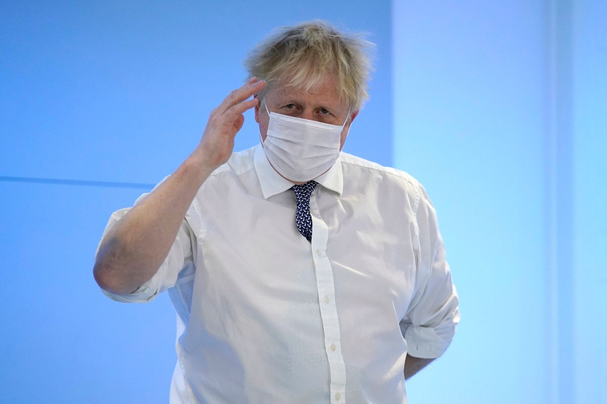 Prime Minister Boris Johnson gestures during a visit to the Rutherford Diagnostic Centre in Taunton, Somerset, Britain, Thursday Jan. 20, 2022. William Wragg, a Tory member of Parliament, said legislators calling for a challenge to Johnson’s leadership have faced “intimidation,” and urged them to contact the police. Wragg accused Johnson’s staff, government ministers and others of “encouraging the publication of stories in the press seeking to embarrass those they who suspect of lacking confidence in the prime minister.”  (Andrew Matthews)