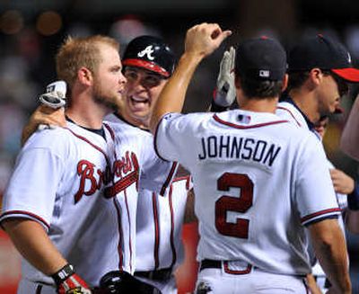 
Brian McCann, left, was hero for Braves with game-winning RBI. Associated Press
 (Associated Press / The Spokesman-Review)