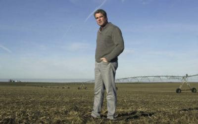 
Clark Kagele walks across his farmland that sits atop the Odessa aquifer, Tuesday, near Odessa, Wash. Kagele has replaced two of the four wells on his 1,700-acre farm after they went dry. 
 (Associated Press / The Spokesman-Review)