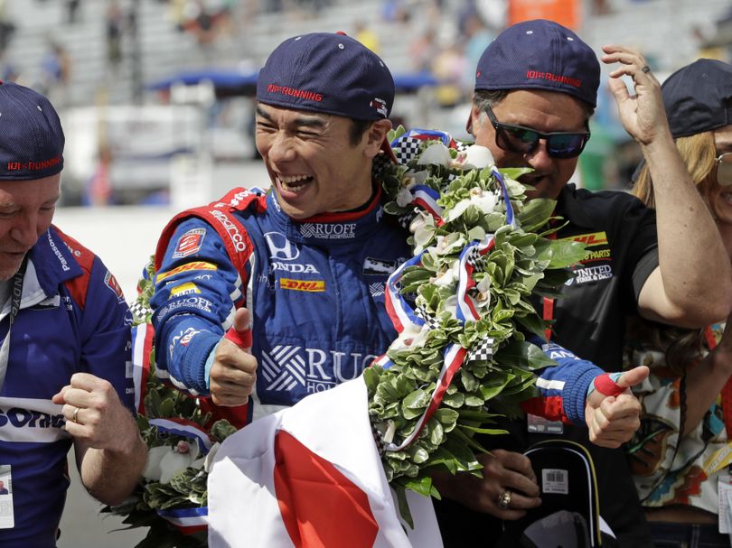 Takuma Sato, of Japan, celebrates after winning the Indianapolis 500 auto race at Indianapolis Motor Speedway, Sunday, May 28, 2017 in Indianapolis. He is the first Japanese driver to win the prestigious race. (R Brent Smith / Associated Press)