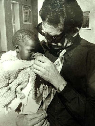 
In this undated photo, Hank Stelzer holds a baby in Lesotho.
 (Courtesy of Hank Stelzer / The Spokesman-Review)