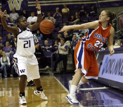 Associated Press Boise State’s Brittany Moore saves the ball as Washington’s Christina Rozier defends. (Associated Press / The Spokesman-Review)
