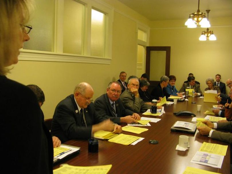 Members of the joint budget committee are briefed by budget analyst Amy Johnson at a 7 a.m. workshop on Thursday on the steps they'll need to take to set the Medicaid budget on Thursday morning. (Betsy Russell)