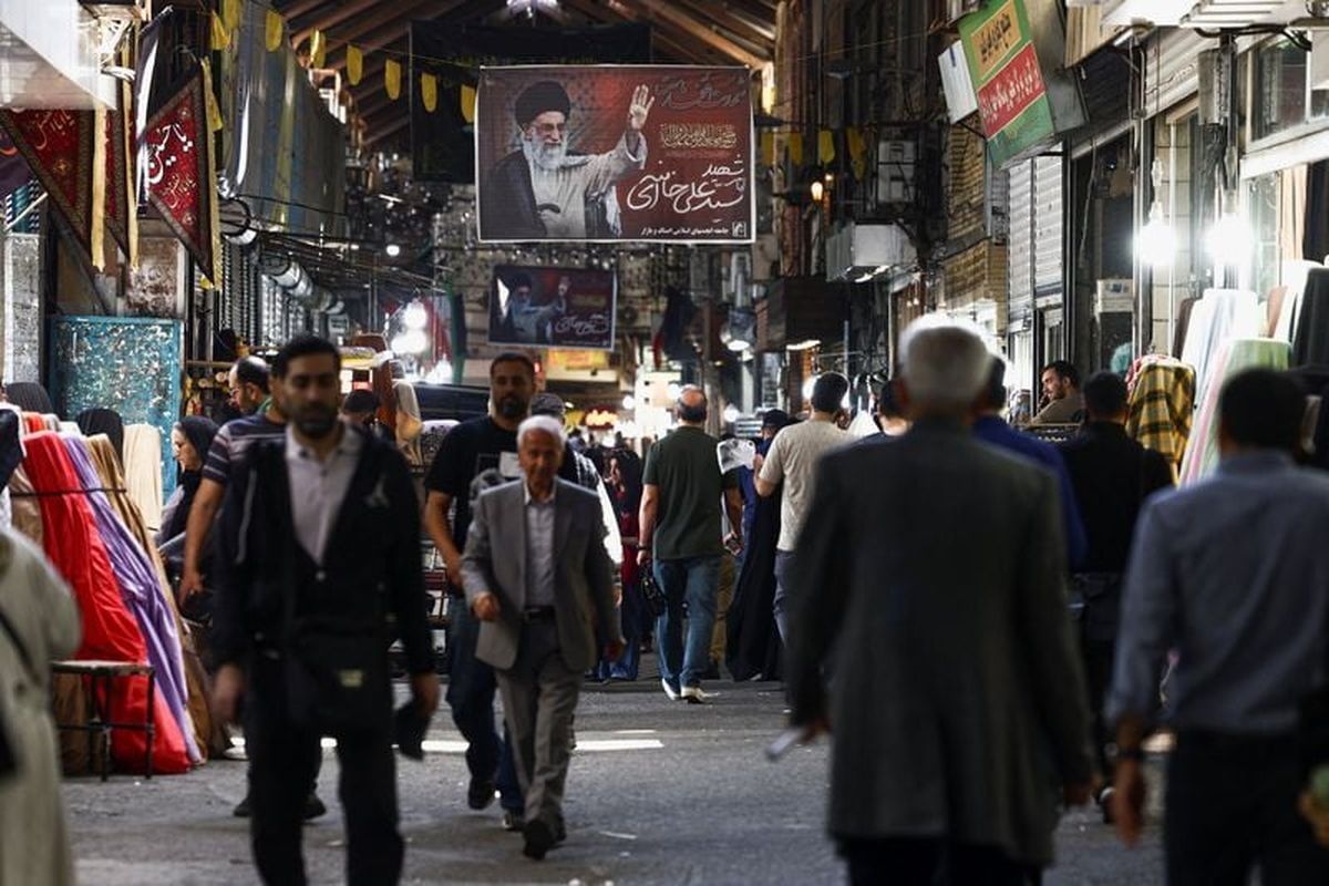 A banner bearing a picture of the late Supreme Leader of Iran, Ayatollah Ali Khamenei, is displayed in Tehran Bazaar, amid a ceasefire between U.S. and Iran on Tuesday in Tehran, Iran.  (Reuters )