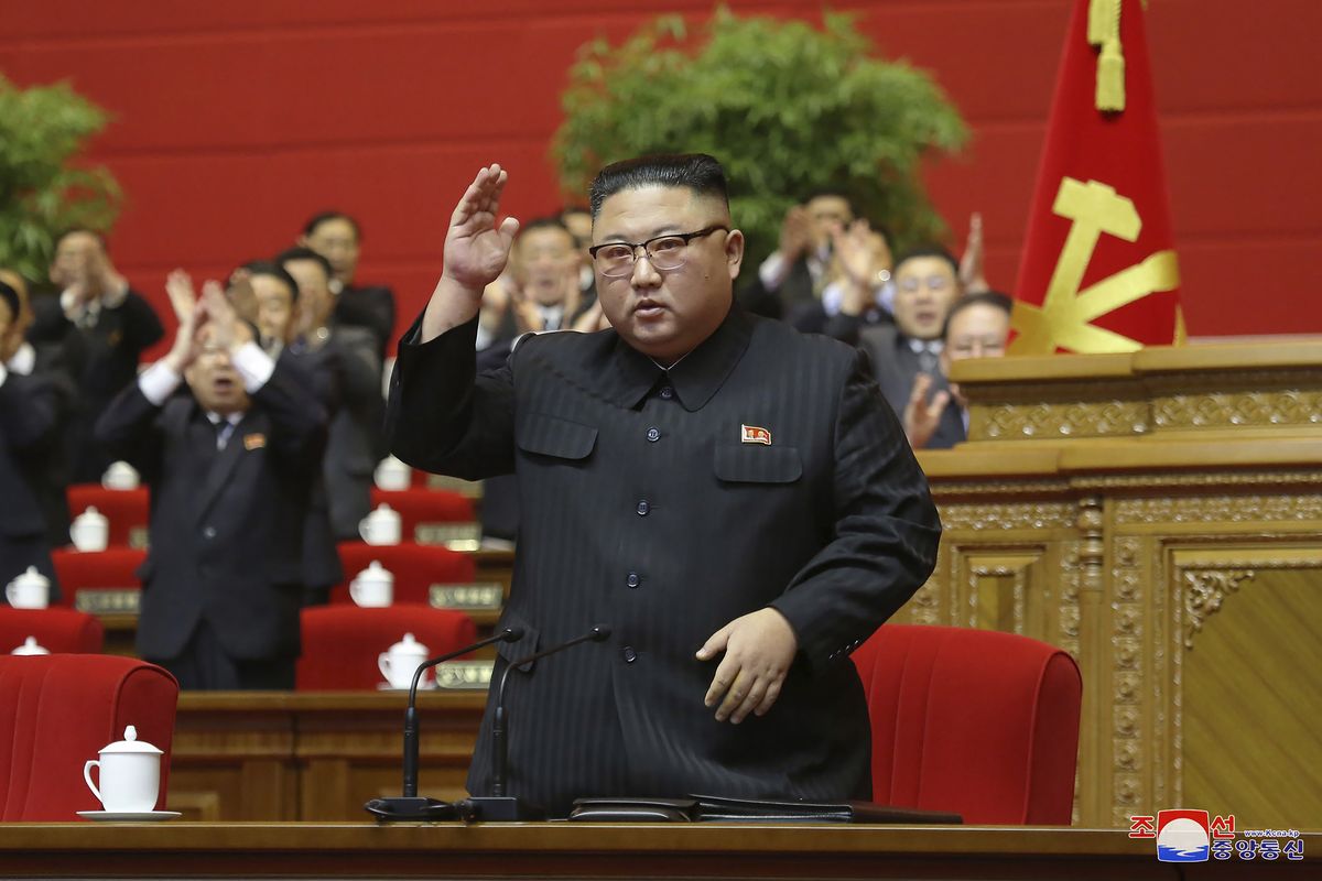 In this photo provided by the North Korean government, North Korean leader Kim Jong Un acknowledges to the applauds after he made his closing remarks at a ruling party congress in Pyongyang, North Korea Tuesday, Jan. 12, 2021. Kim vowed all-out efforts to bolster his country