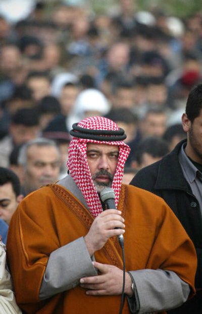 
Hamas' top candidate for the upcoming Palestinian legislative elections, Ismail Hanieh, leads a prayer in Gaza City on Tuesday. Hamas, the armed Islamic Palestinian group, appears set to fare well in the Jan. 25 balloting. 
 (Associated Press / The Spokesman-Review)
