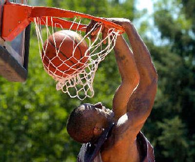 
Air Force mechanic Kirk Sheppard wins men's slam-dunk contest. 
 (Christopher Anderson / The Spokesman-Review)