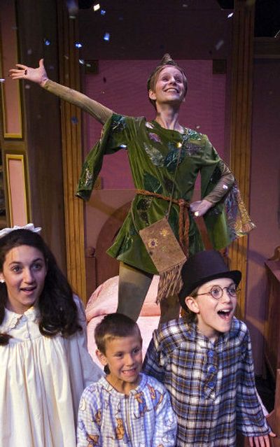 
Peter Pan, played by Haley New Ostrander, throws confetti during a rehearsal of 