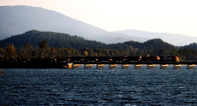 A train crosses Lake Pend Oreille as it leaves Sandpoint on Tuesday morning. BNSF wants to build a parallel trestle by 2018. (Kathy Plonka)