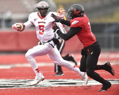 Tre Roberson, left, is chased by EWU safety Tevin McDonald. The Eagles had trouble containing the Redbirds quarterback all day. (Tyler Tjomsland)