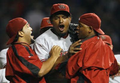 
Jose Valverde, center, and teammates celebrate at Wrigley Field. Associated Press
 (Associated Press / The Spokesman-Review)