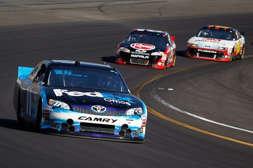 (Front to rear) Denny Hamlin leads Kevin Harvick and Greg Biffle late in the NASCAR Sprint Cup Series Subway Fresh Fit 500 on Sunday at Phoenix International Raceway in Avondale, Ariz. (Photo Credit: Todd Warshaw/Getty Images for NASCAR) (Todd Warshaw / Getty Images North America)