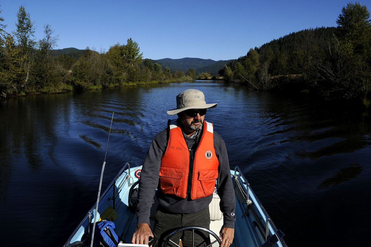Ed Moreen, with the EPA’s Coeur d’Alene field office, boats through the Killarney channel to the Coeur d’Alene River to check on a coring operation Friday. (Kathy Plonka)
