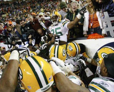 
Packers receiver Greg Jennings receives a hero's welcome from his teammates. Associated Press
 (Associated Press / The Spokesman-Review)