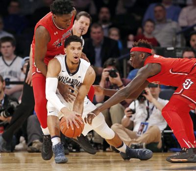 Villanova guard Josh Hart (3) looks to pass as St. John’s forwards Darien Williams (45) and forward Tariq Owens, right, defend during the second half of an NCAA college basketball game in the quarterfinals of the Big East Conference tournament at Madison Square Garden, Thursday, March 9, 2017, in New York. (Kathy Willens / Associated Press)