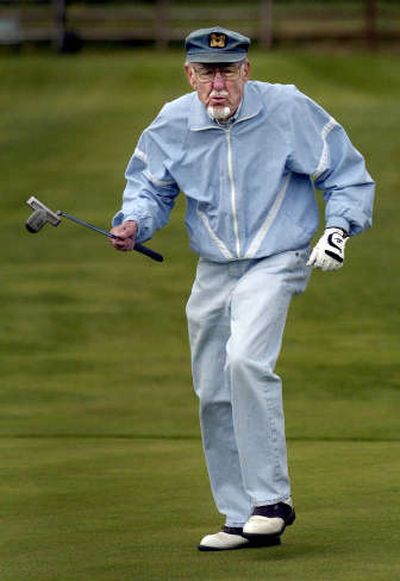 
Gene Grossmann Jr. grimaces at a missed putt Wednesday at Eagle Ridge golf course. He holds the nine-hole record at the course.
 (Jed Conklin / The Spokesman-Review)