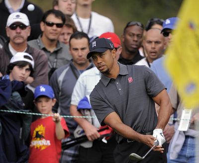 Tiger Woods chips to the first green during the second round of the Chevron World Challenge in Thousand Oaks, Calif. (Associated Press)