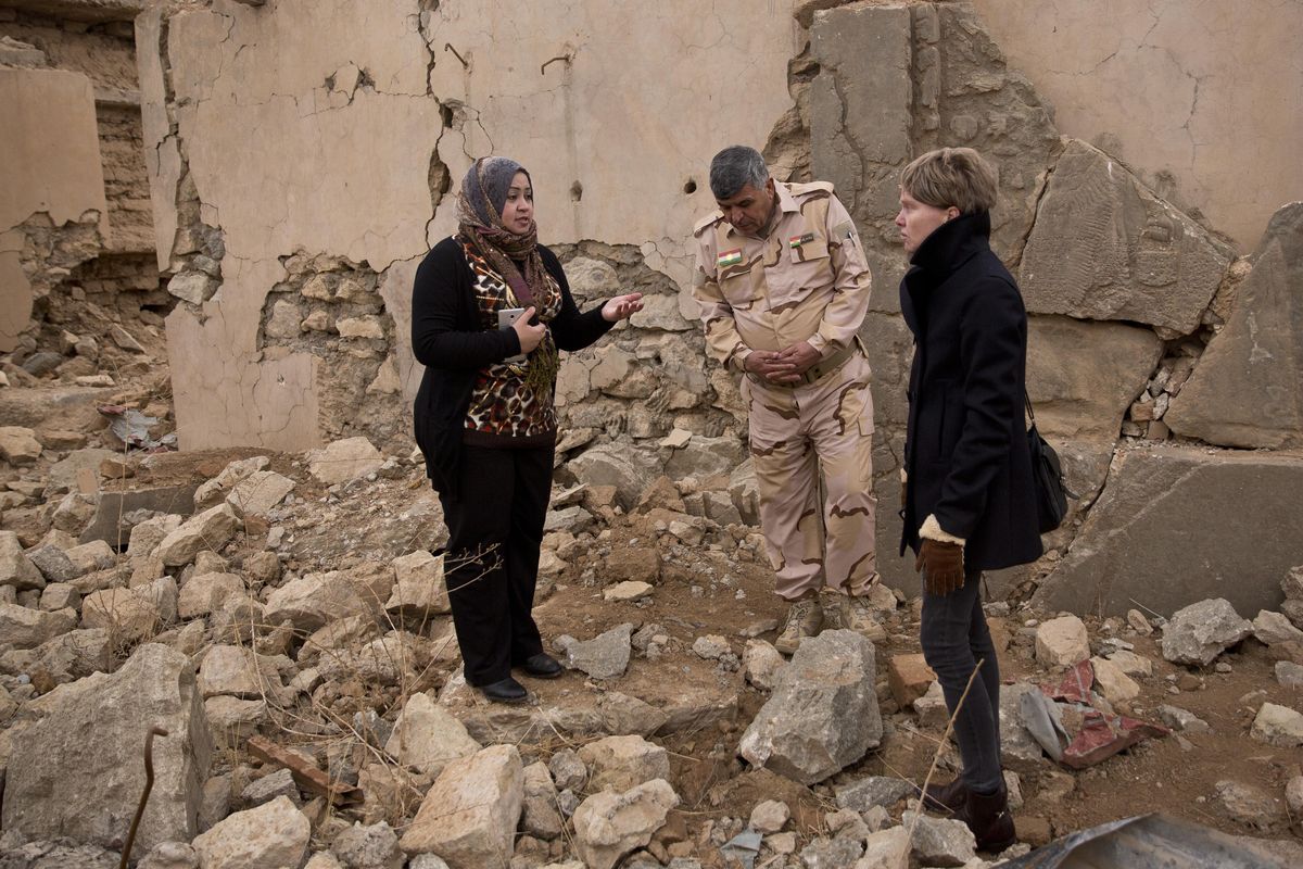 Iraq archaeologist Layla Salih, left, confers with UNESCO’s representative in Iraq Louse Haxthausen, right, at the ancient site of Nimrud, Iraq, on Wednesday, Dec. 14, 2016. (Maya Alleruzzo / Associated Press)