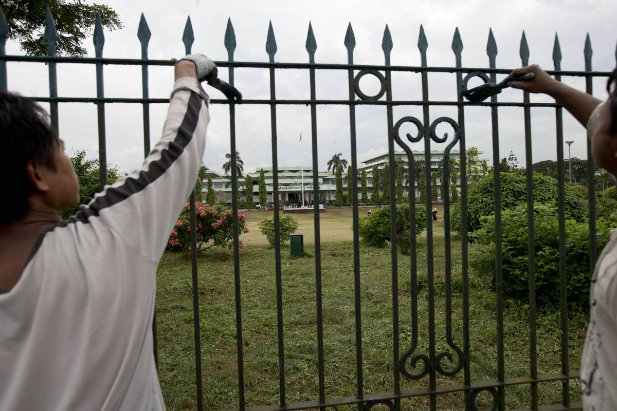 Workers paint the fencing of the Yangon Parliament building where US president Barack Obama is anticipated to meet Myanmar's President Thein Sein in Yangon, Myanmar, Thursday, Nov. 15, 2012. Obama, who visits Myanmar on November 19,  will meet democracy icon Aung San Suu Kyi and President Thein Sein on the first visit to the country by a sitting US president. (Gemunu Amarasinghe / Associated Press)
