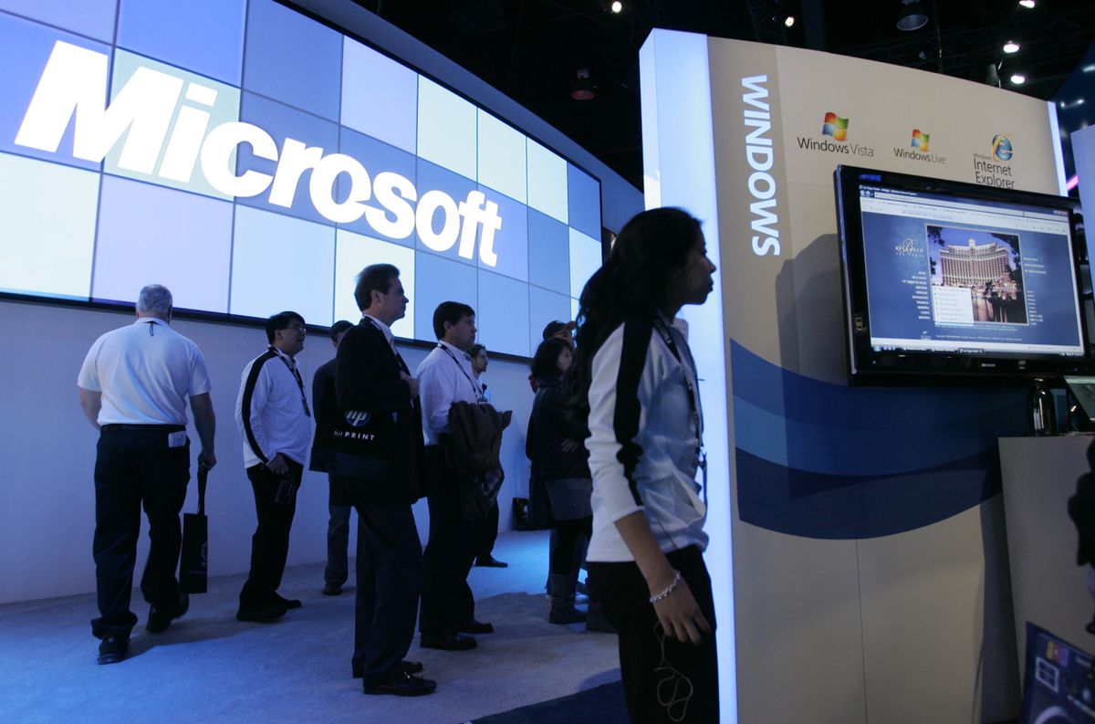 Microsofts’ Windows 7 is on display in the Microsoft booth at the International Consumer Electronics Show in Las Vegas earlier this month. Microsoft Corp. said Thursday it is cutting 5,000 jobs over the next 18 months.Associated Press file photos (Associated Press file photos / The Spokesman-Review)