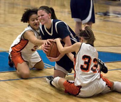 
Special to The Spokesman-Review Lake City's Jacie Estes, center, battles for the ball against Post Falls' Katelyn Loper, left, and Tori Davenport in the second half.
 (BRUCE TWITCHELL Special to / The Spokesman-Review)