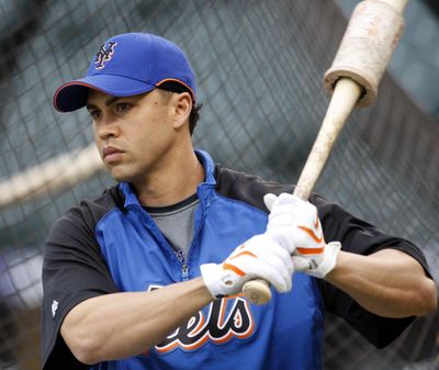 In this May 23, 2008 photo, New York Mets outfielder Carlos Beltran waits to bat before facing the Colorado Rockies in the first inning of a baseball game in Denver. A person familiar with the decision tells The Associated Press the New York Mets have decided to hire Carlos Beltrán as their manager. (David Zalubowski / Associated Press)