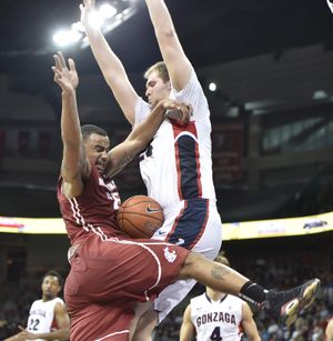 Washington State guard DaVonte Lacy drives the ball straight into a wall of Gonzaga center Przemek Kanowski during the second half of a college basketball game on Wednesday, Dec 10, 2014, at Spokane Veterans Memorial Arena in Spokane, Wash. Gonzaga won the game 81-66. (Tyler Tjomsland / The Spokesman-Review)