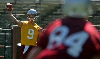 
WSU quarterback Josh Swogger is happy to be back on the field after missing several games to injury last year, including the Cougars' victories over UCLA and Washington. 
 (Christopher Onstott/ / The Spokesman-Review)