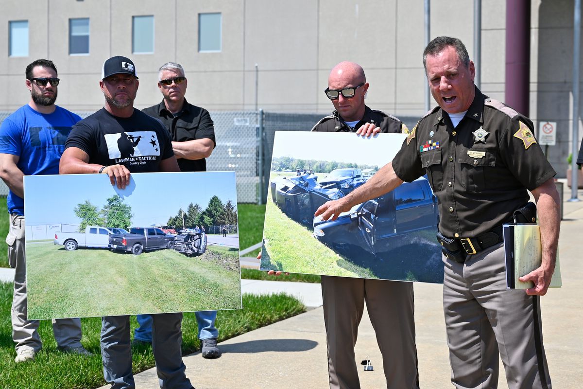 Vandenburgh County Sheriff Dave Wedding, right, refers to a photograph during a press conference in Evansville, In., Tuesday, May 10, 2022, about the capture of fugitives Casey White and Vicky White.  (Timothy D. Easley)