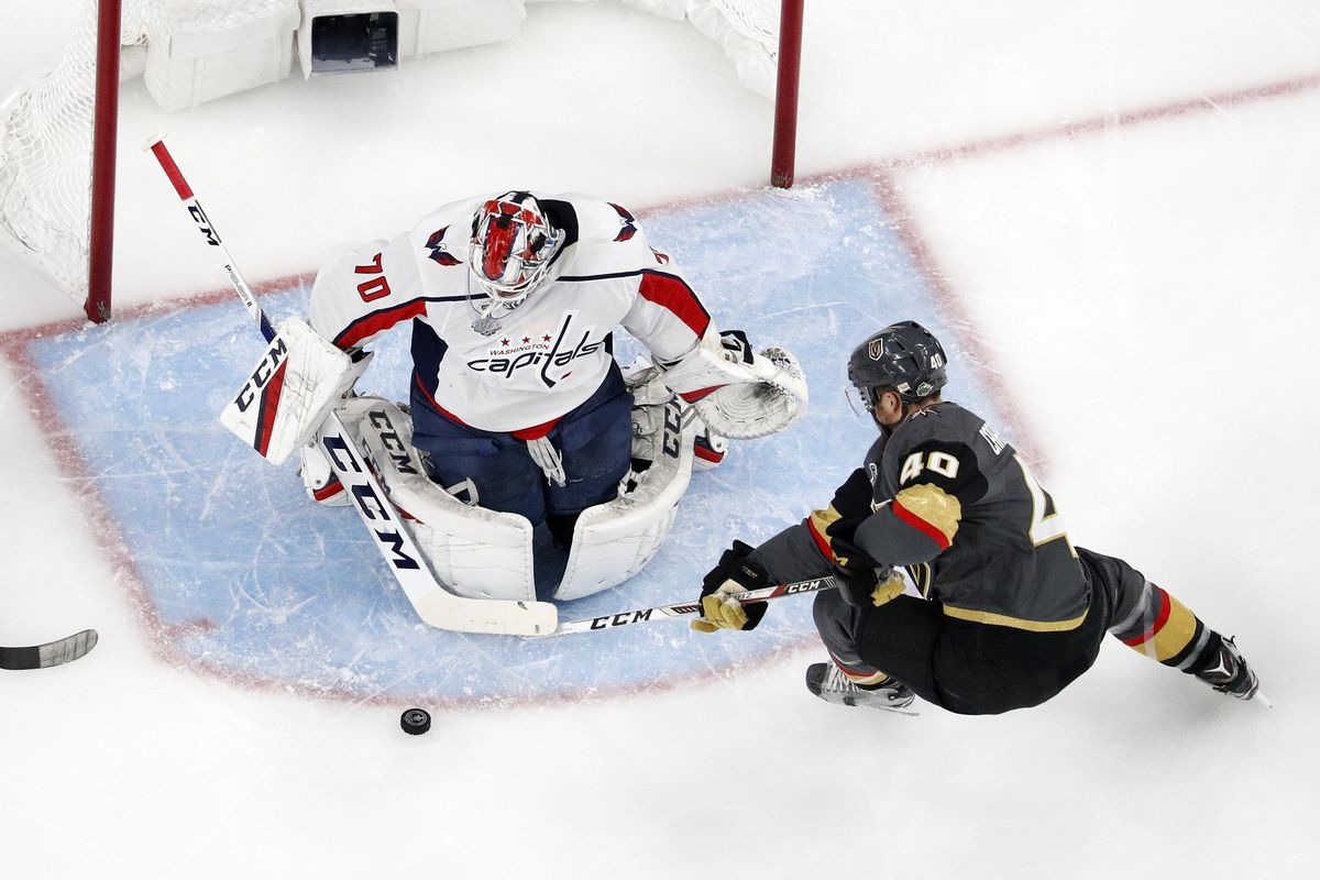 Vegas Golden Knights center Ryan Carpenter tries to get a shot past Washington Capitals goaltender Braden Holtby during the first period Wednesday in Las Vegas. (John Locher / AP)