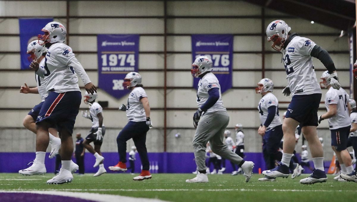 New England Patriots players warm up during a practice at the Minnesota Vikings’ facility on Friday in Minneapolis. The Patriots are scheduled to face the Philadelphia Eagles in Super Bowl 52 on Sunday. (Mark Humphrey / AP)