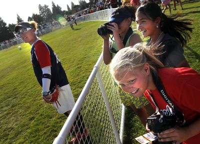 Tressa Radach, 12, front, and her friends Haylee Orozco, 11, and Hailee Bishop, 12, all from Moses Lake, get a close look at their idols, the 2008 Olympic softball team, during a game Thursday against the Spokane  All-Stars at Franklin Park in Spokane. See results in Sports, C1.  (Rajah Bose / The Spokesman-Review)