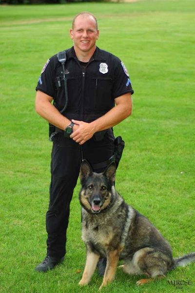 Spokane police Senior Officer Dan Lesser and his K9 partner, Var, are pictured in this photograph released by the Spokane County Sheriff's Office.  (Spokane County Sheriff's Office)