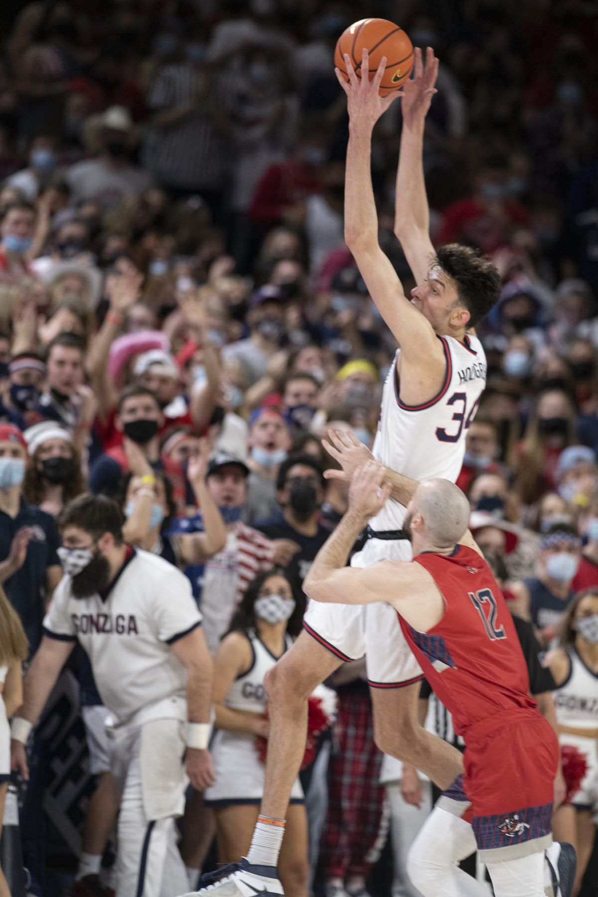Gonzaga's Chet Holmgren goes up high for a rebound over St. Mary's Tommy Kuhse (12) in the first half of the West Coast Conference game Saturday, Feb. 12, 2022 at McCarthey Athletic Center at Gonzaga University in Spokane, Washington.  (Jesse Tinsley/The Spokesman-Review)