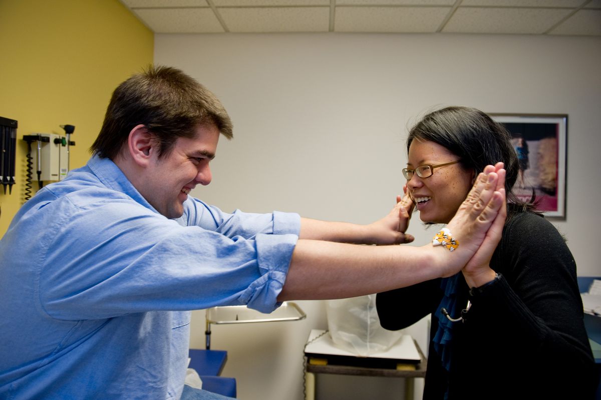 Shawn Helbig, 27, who has Fragile X syndrome, visits Emory University’s Department of Human Genetics in Atlanta, where he is taking part in a clinical trial to find a treatment for the genetic condition. Dr. Jeannie Visootsak, with the genetics department, tests Helbig’s strength as part of his physical.  (Associated Press)
