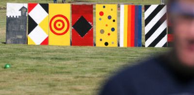 
A bank of painted targets lines a field on the University of Idaho campus where Gavin Lichthardt and other Junior Engineer Math and Science participants aim to hit with projectiles launched from trebuchets they designed and built. 
 (Christopher Onstott/ / The Spokesman-Review)