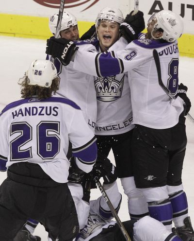 Michal Handzus goes to celebrate with his teammates after scoring the tiebreaking goal in the Kings’ win over the Stars. (Associated Press)