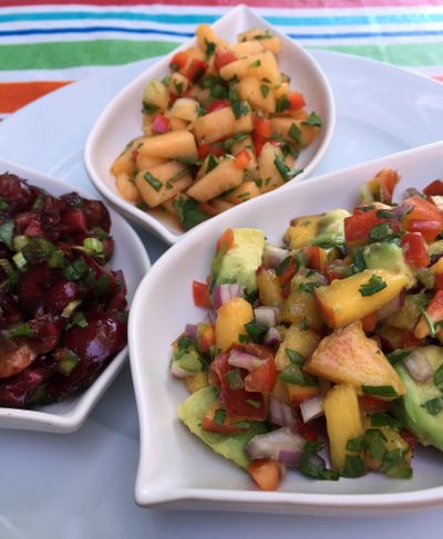 Here’s a trio of summer salsas that will dress up any grilled meats or seafood, or, simply serve with chips. Clockwise from left: Cherry Salsa, Melon Salsa and Nectarine Avocado Salsa. (Lorie Hutson)