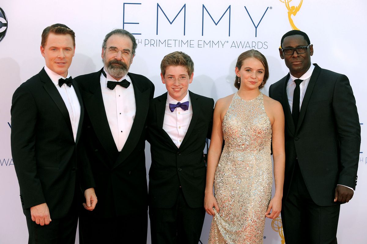 The cast of "Homeland", from left, Diego Klattenhoff, Mandy Patinkin, Jackson Pace, Morgan Saylor and David Harewood, arrives at the 64th Primetime Emmy Awards at the Nokia Theatre on Sunday, Sept. 23, 2012, in Los Angeles.  (Photo by Jordan Strauss/Invision/AP) (Jordan Strauss / Invision)