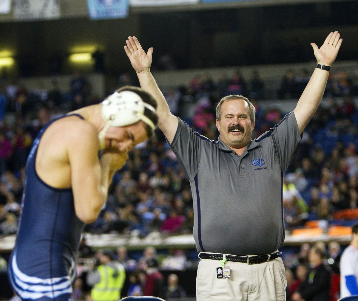 Ron Beard signals victory after his son, CV’s Blake Beard, left, won the 126-pound championship. (Patrick Hagerty)