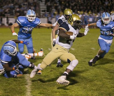 Mead's EJ Bade rushes for a gain during the first quarter against Central Valley Friday night at Central Valley HIgh School. (BRUCE TWITCHELL / BRUCE TWITCHELL Special to The Spokesman-Review)