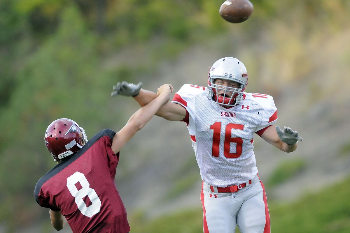 Ferris defensive lineman Drew Sharkey, right, takes down North Central quarterback Zac Hill in the first quarter.danp@spokesman.com (Dan Pelle / The Spokesman-Review)