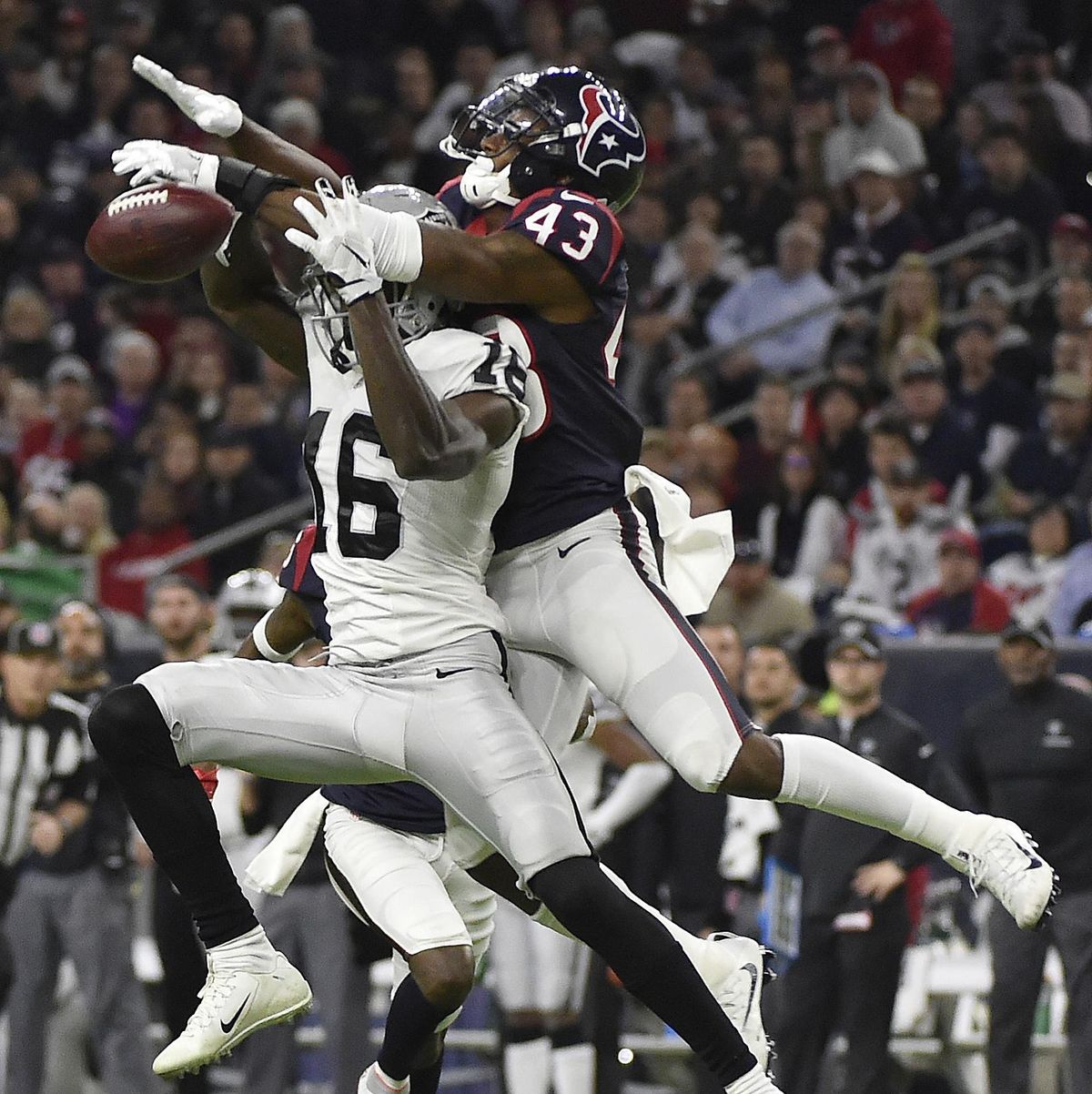Houston Texans strong safety Corey Moore (43) breaks up a pass intended for Oakland Raiders wide receiver Johnny Holton (16) during the second half of an AFC Wild Card NFL game Saturday, Jan. 7, 2017, in Houston. The Houston Texans won 27-14. (Eric Christian Smith / Associated Press)