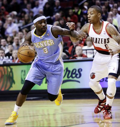 Ty Lawson scored 30 points in the Nuggets’ win over the Trail Blazers in Portland. (Associated Press)