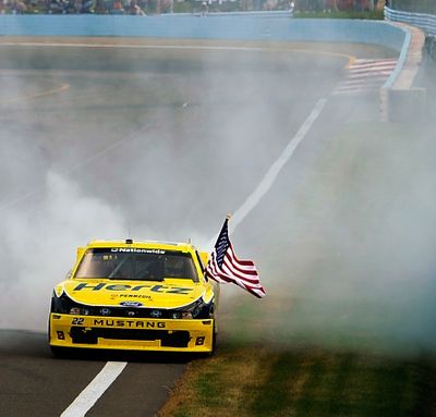 Brad Keselowski, driver of the #22 Hertz Ford, celebrates with a burnout after winning the NASCAR Nationwide Series Zippo 200 at Watkins Glen International on August 10, 2013 in Watkins Glen, New York. (Photo Credit: Jared C. Tilton/NASCAR via Getty Images) (Jared Tilton / Nascar)