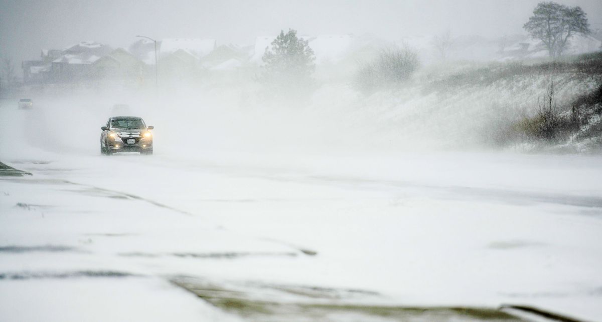 Drivers brave the drifting and blowing snow on Appleway Rd. in Liberty Lake on Monday, Feb. 21, 2022.  (Kathy Plonka/The Spokesman-Review)