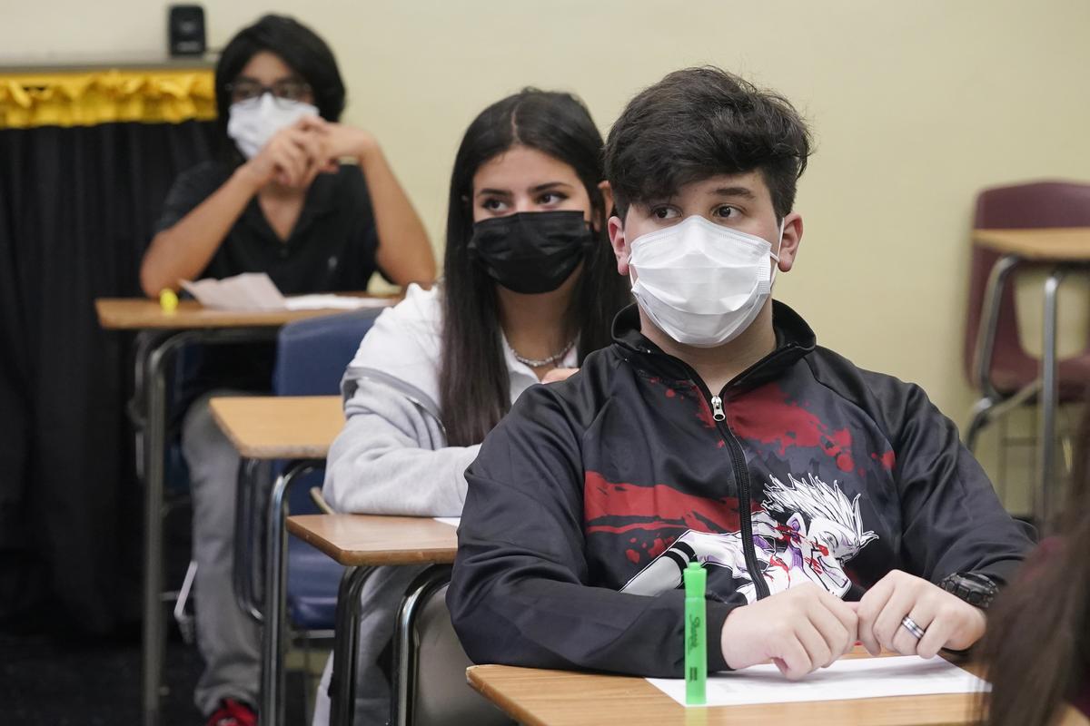 Students sit in an Algebra class at Barbara Coleman Senior High School on the first day of school, Monday, Aug. 23, 2021, in Miami Lakes, Fla. Miami-Dade County public schools require students to wear a mask to prevent the spread of COVID-19. (Marta Lavandier)