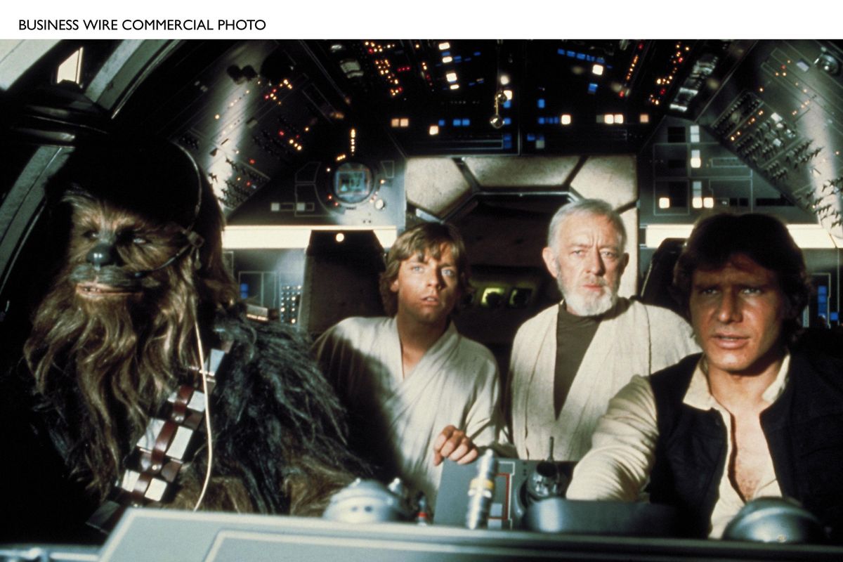 Chewbacca, Luke Skywalker (Mark Hamill), Ben (Obi-Wan) Kenobi (Alec Guinness), and Han Solo (Harrison Ford) in the Millennium Falcon in “Star Wars.” (Lucasfilm Ltd.)