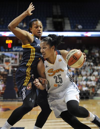 Connecticut’s Alyssa Thomas, right, drives to the basket Tuesday. (Associated Press)